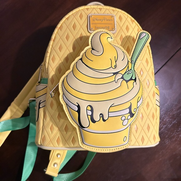 Loungefly Handbags - Disney Loungefly Pineapple Swirl Backpack NWT